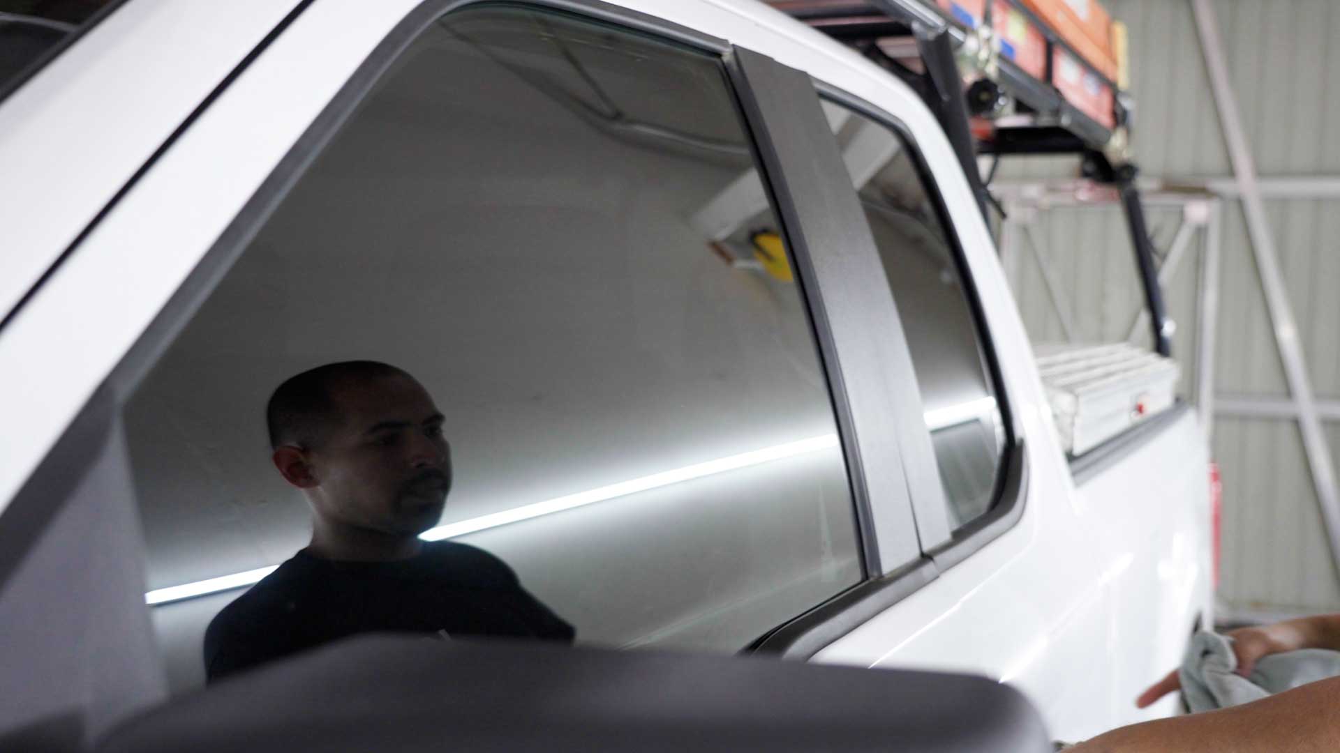 Skilled Tesla Window Tinting being cleaned after tinting in Pembroke Pines