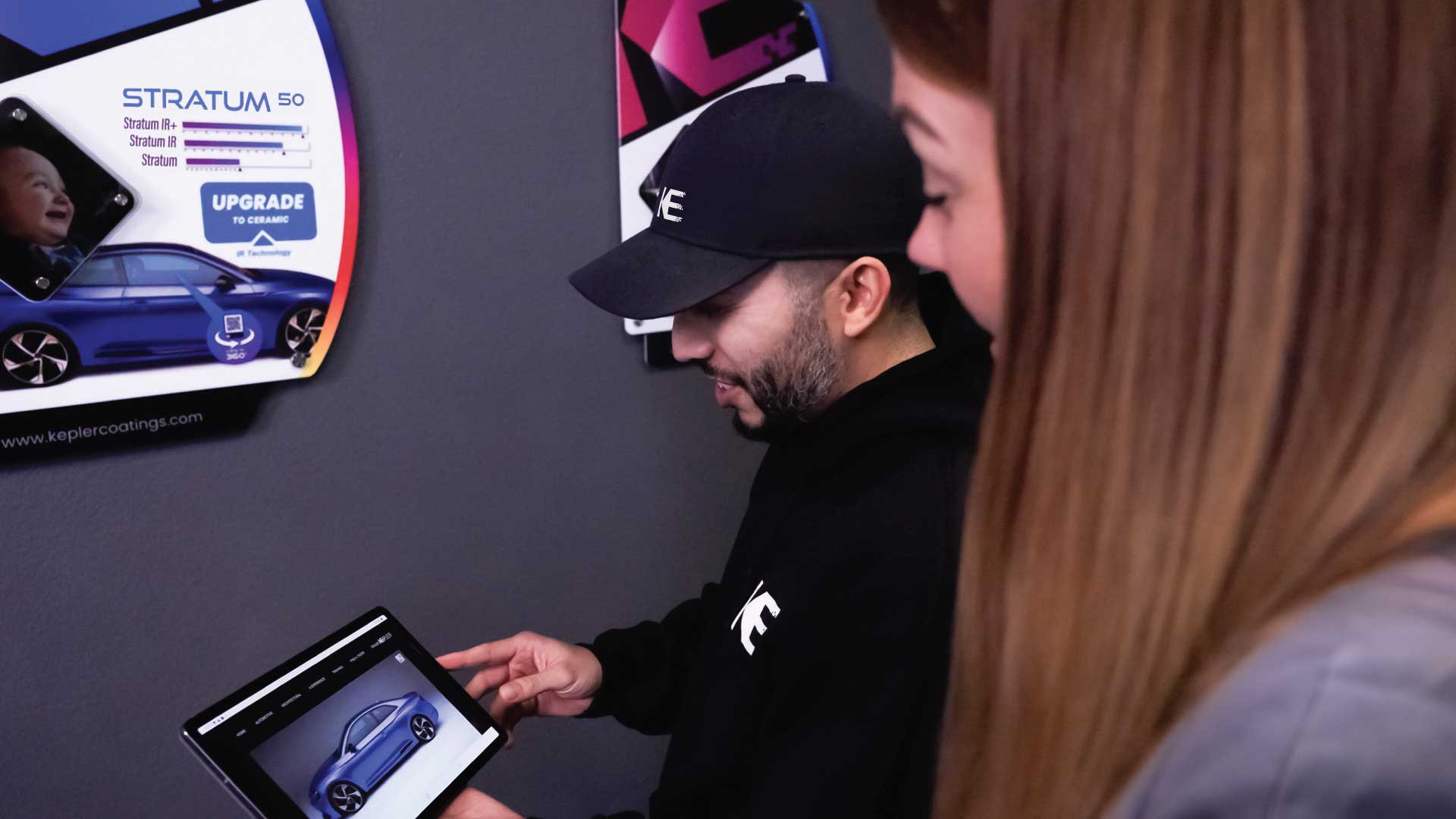 Kepler Dealer Showing Window Film Options to Customer in South Windsor, Connecticut