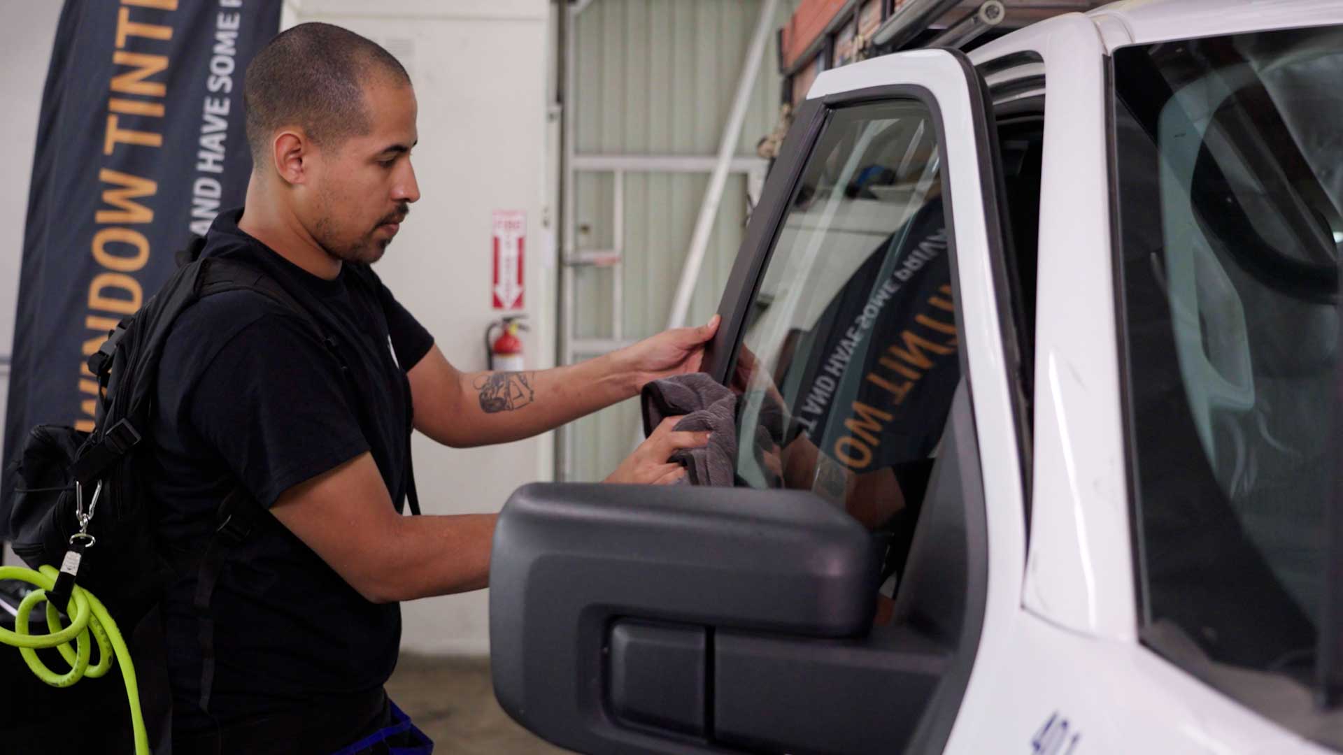Professional Tesla Glass Tint being cleaned after tinting in Porterville
