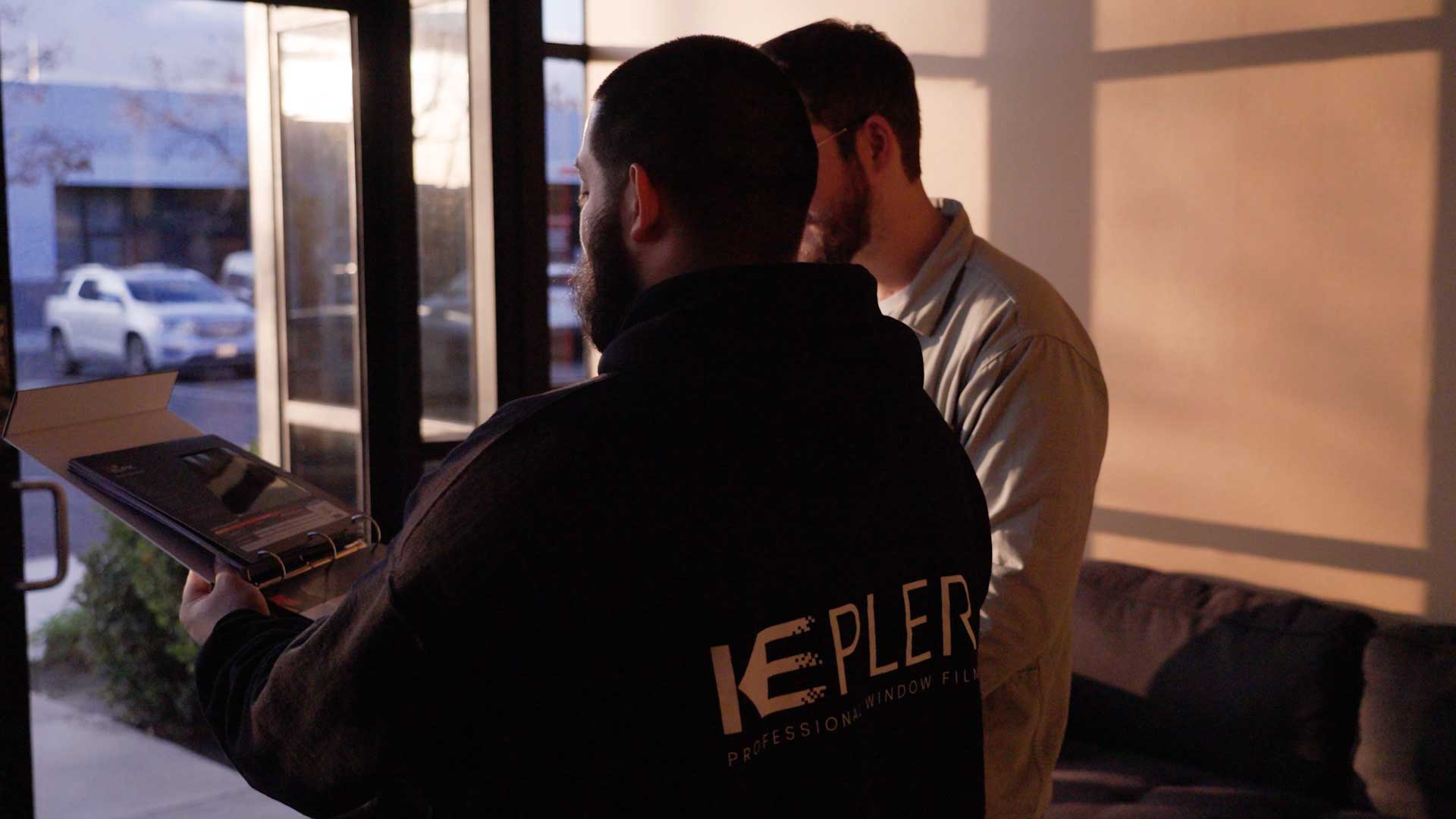 Kepler Dealer Showing Customer the Benefits of Commercial Window Film in Alaska