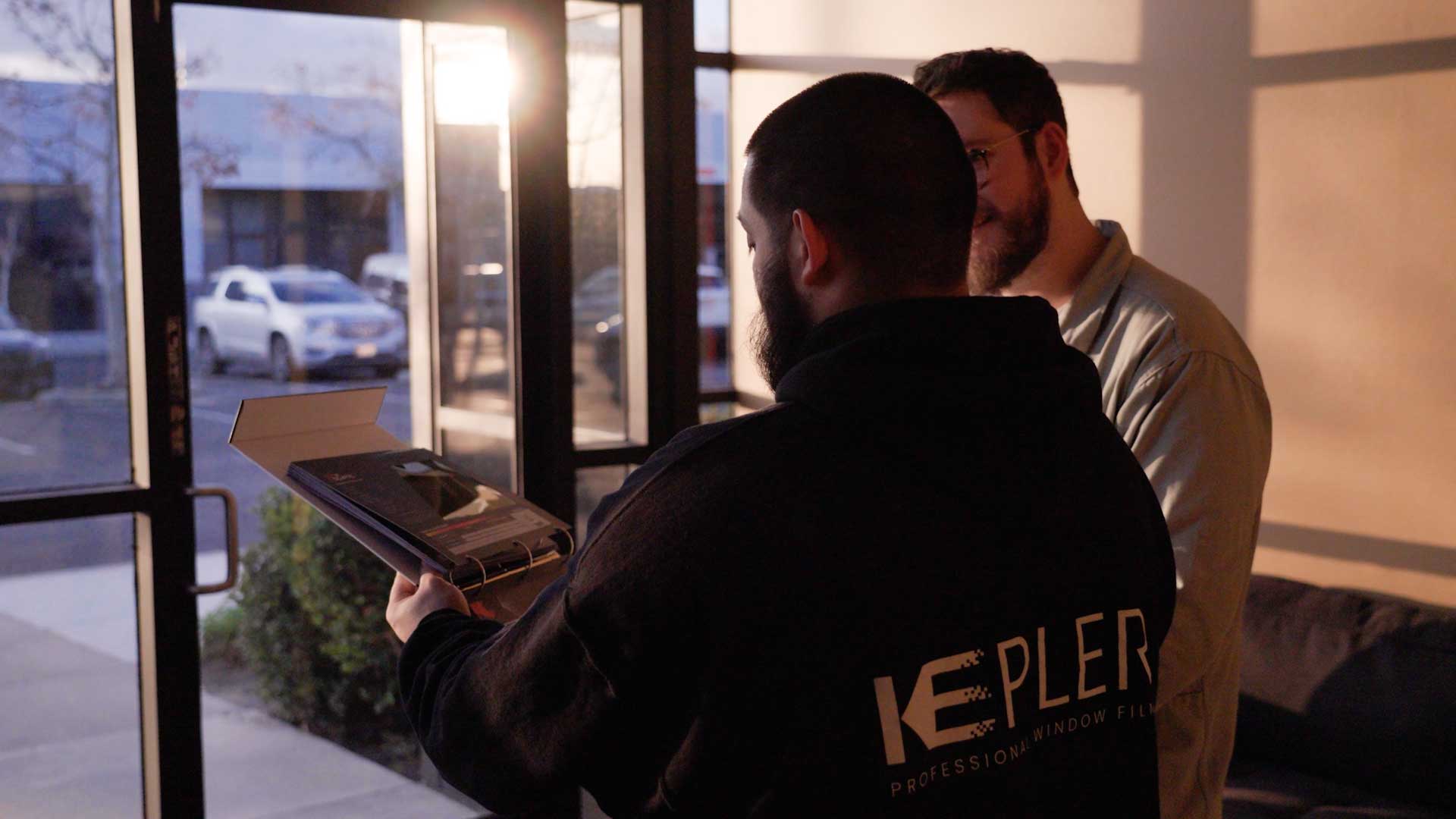 Kepler Dealer Showing Customer the Benefits of Commercial Window Film in Hawaii