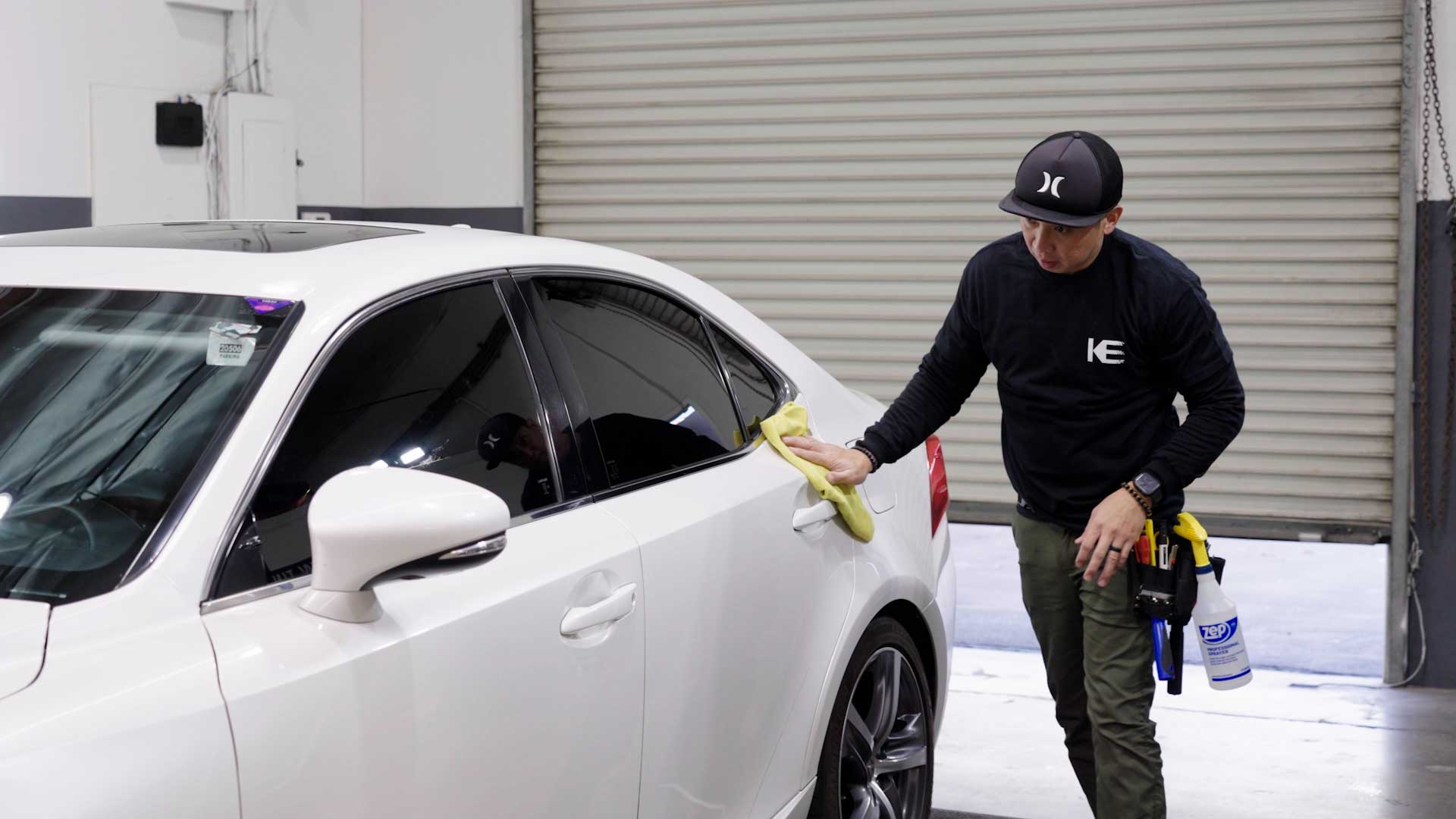 Skilled Tesla Glass Tinting being cleaned after tinting in Altamonte Springs