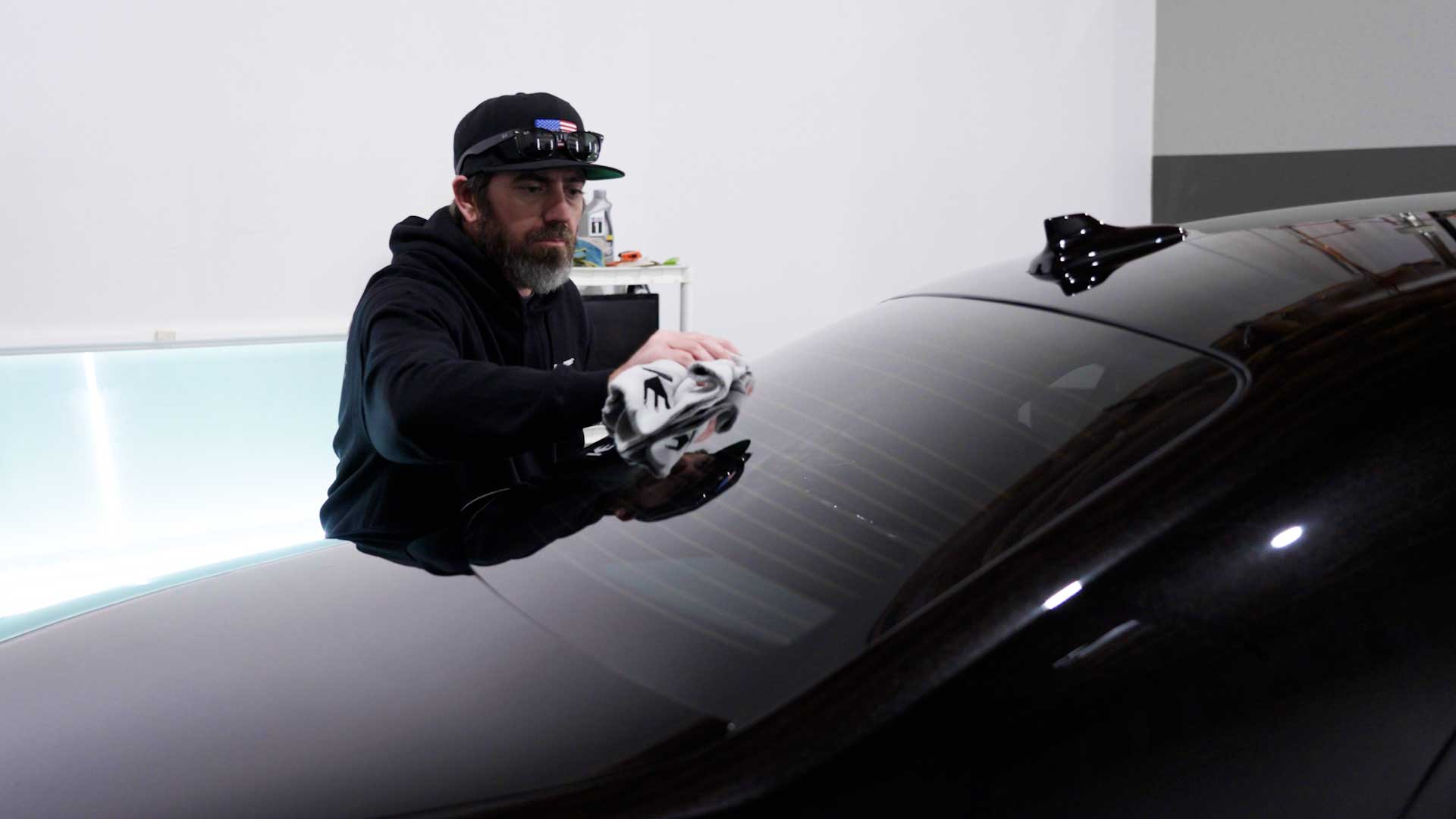 Professional Electric Vehicle Window Tinting being cleaned after tinting in Chino Hills