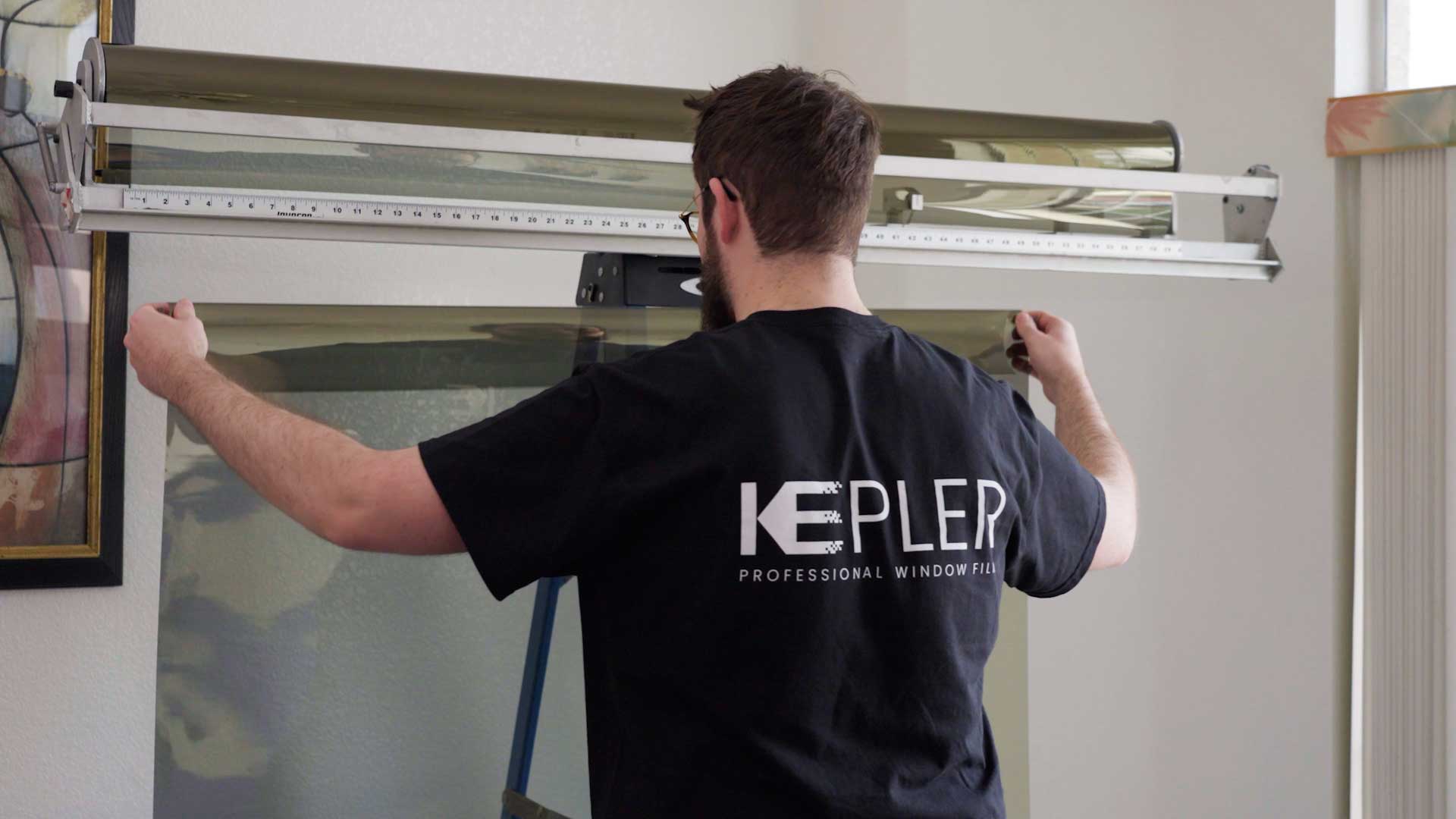 Kepler Home Window Tinting Specialist Preparing Film for Legal Residential Application in New Hampshire