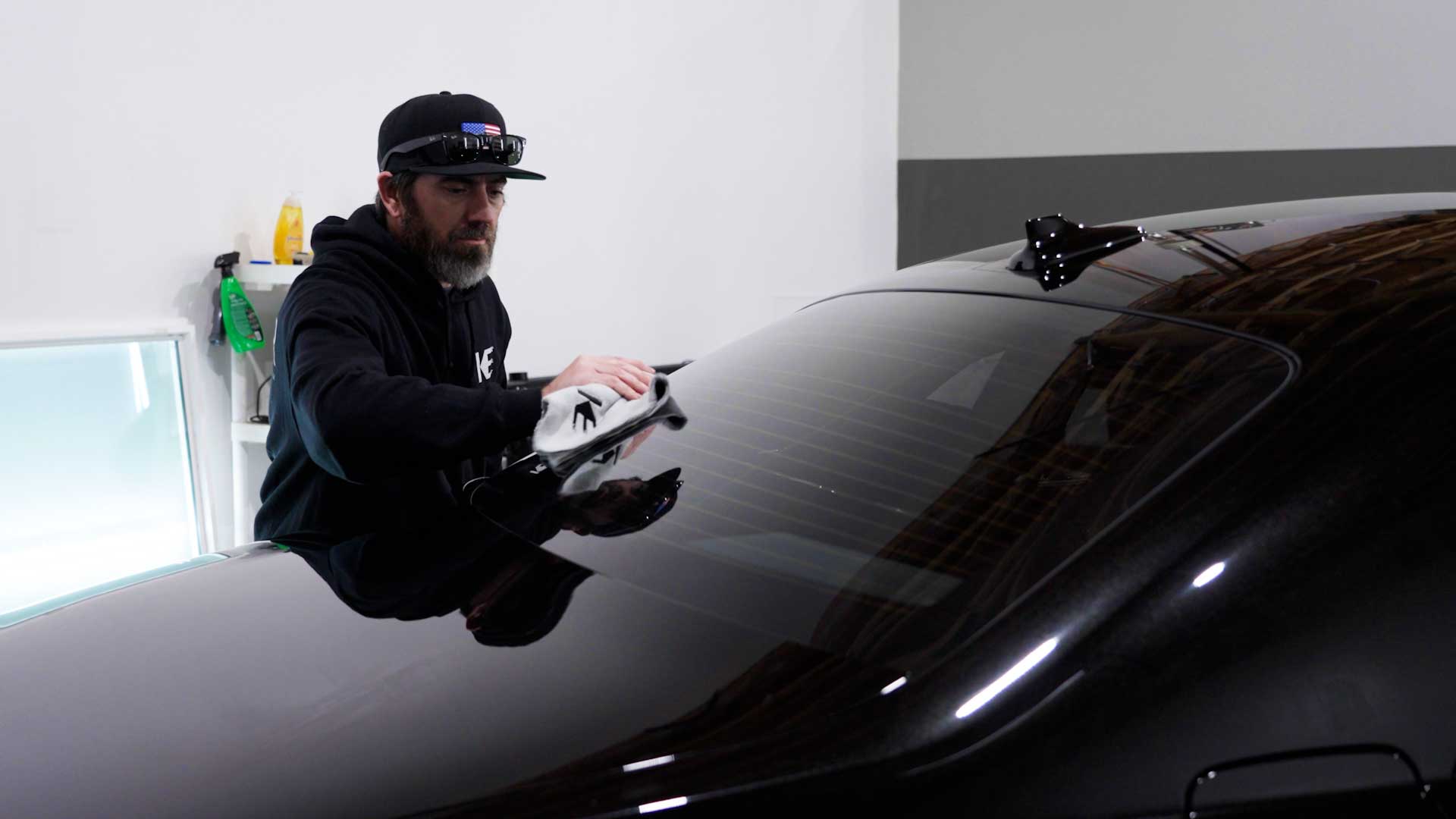 Professional Tesla Glass Tint being cleaned after tinting in Royal Oak