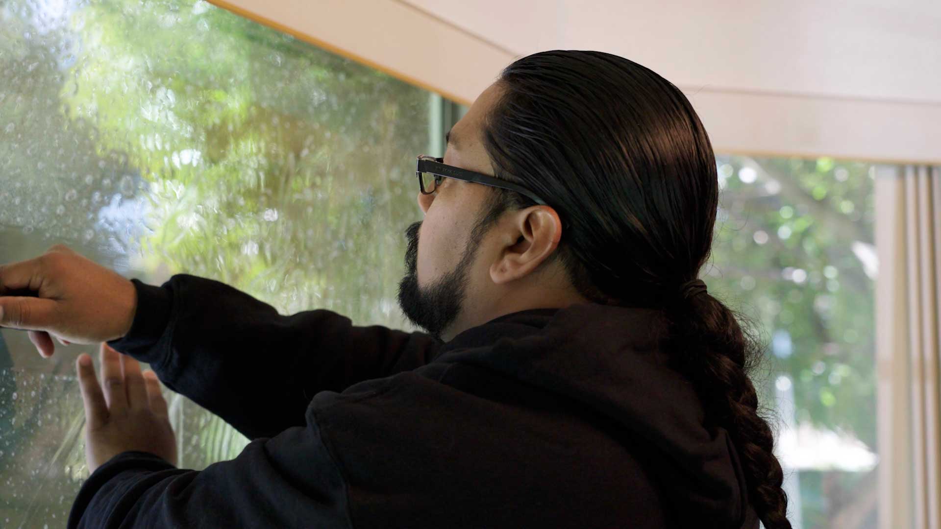 Kepler Installer Applying Security Window Film to a Building in Hawaii