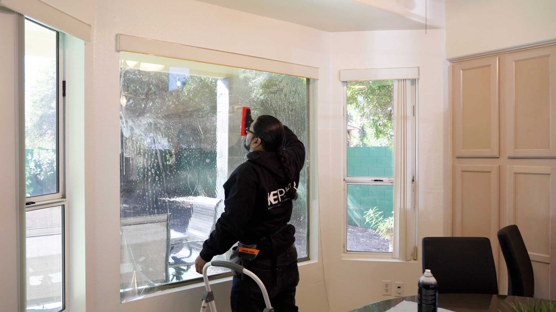 Kepler Installer Applying Security Window Film to a Building in Georgia