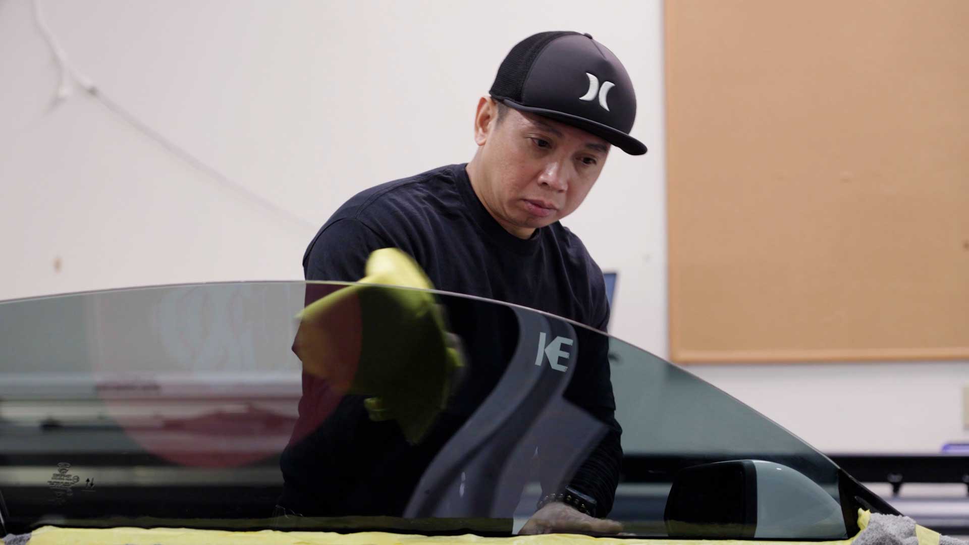 Skilled Electric Vehicle Glass Tinting being cleaned after tinting in Las Vegas