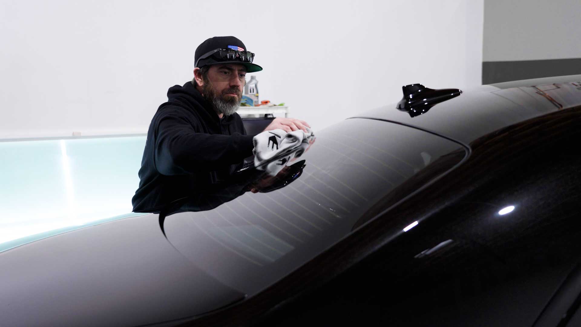 Professional Tesla Glass Tint being cleaned after tinting in North Miami Beach