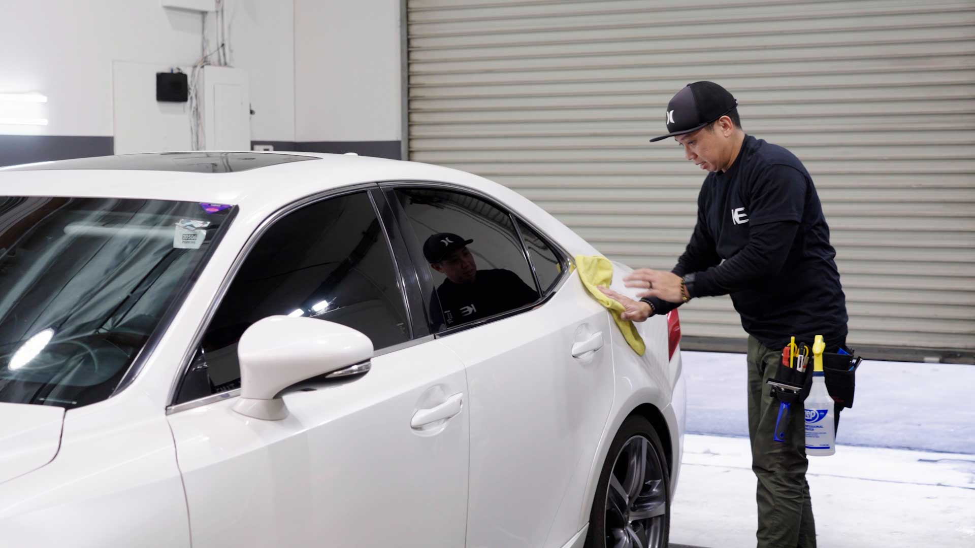 Skilled Tesla Glass Tint being cleaned after tinting in Elk Grove