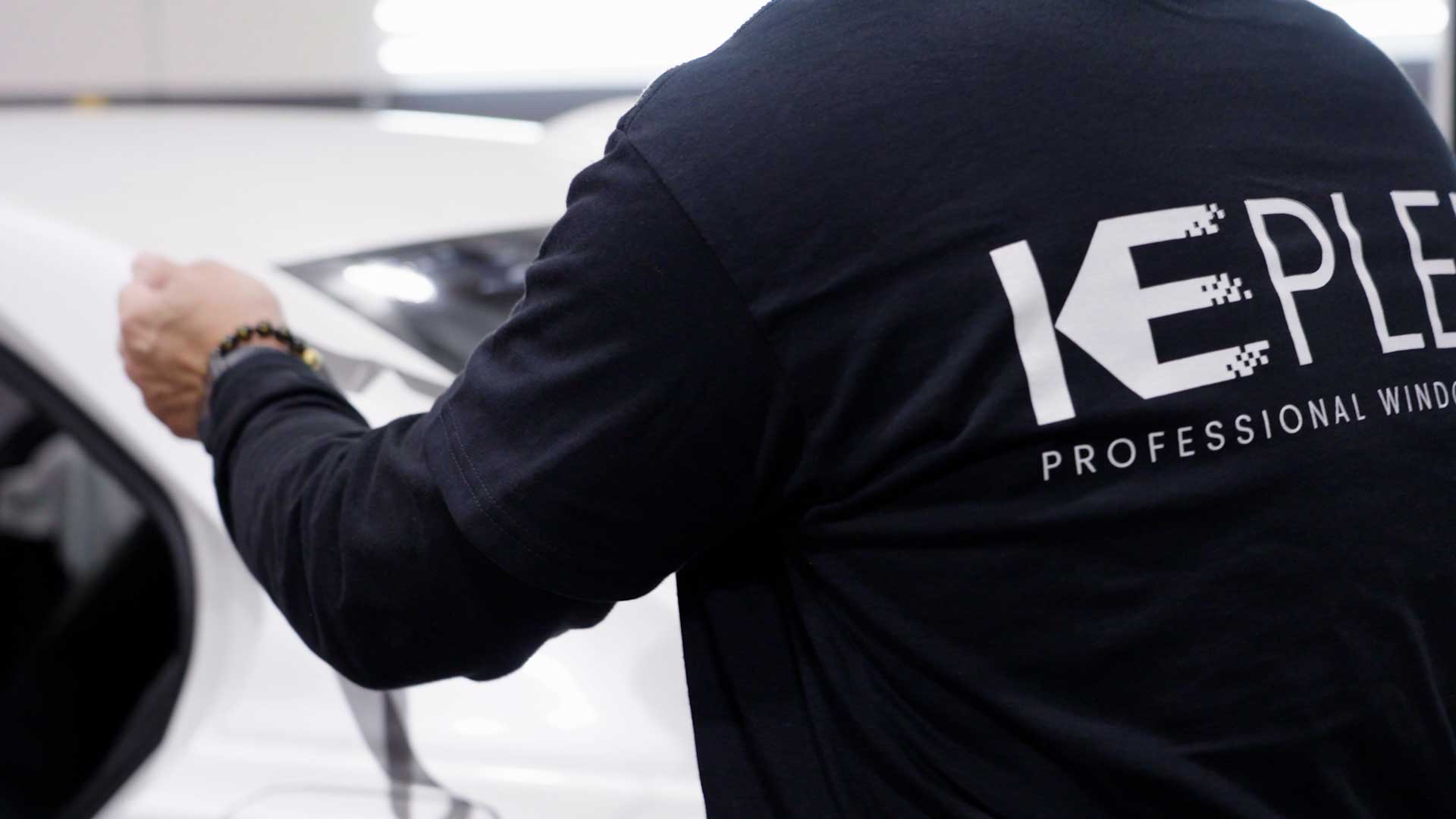 Window Tinting Specialist Cutting Film in Shirley, New York