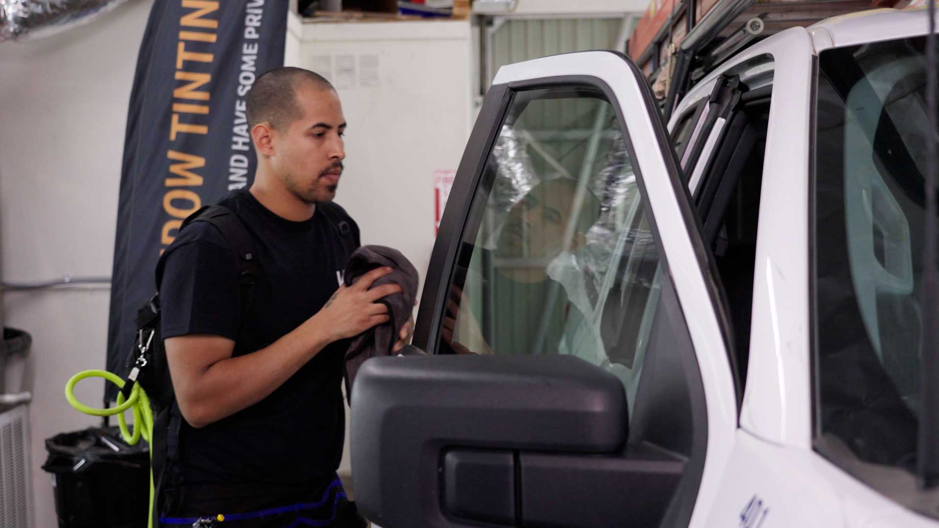 Skilled Tesla Glass Tint being cleaned after tinting in Griffin