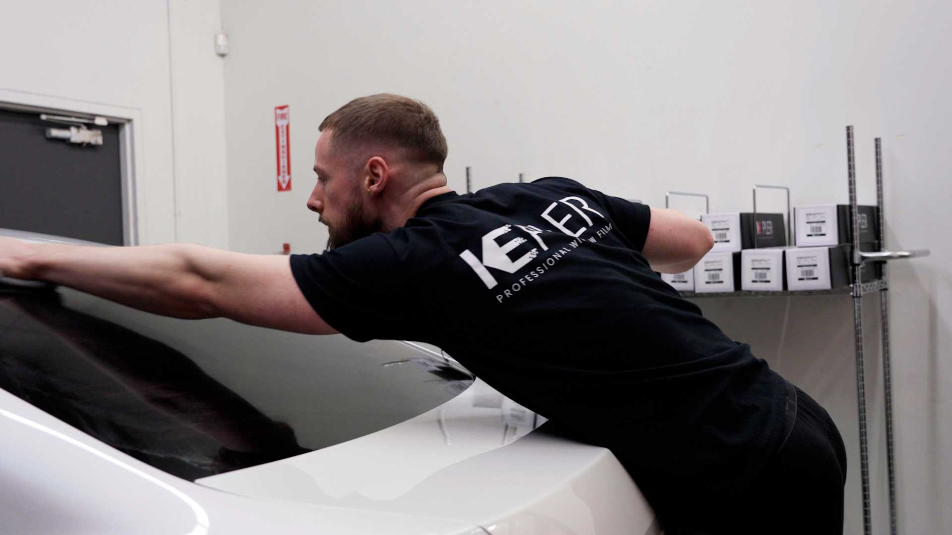 Expert Tesla Window Tinting being cleaned after tinting in Savage