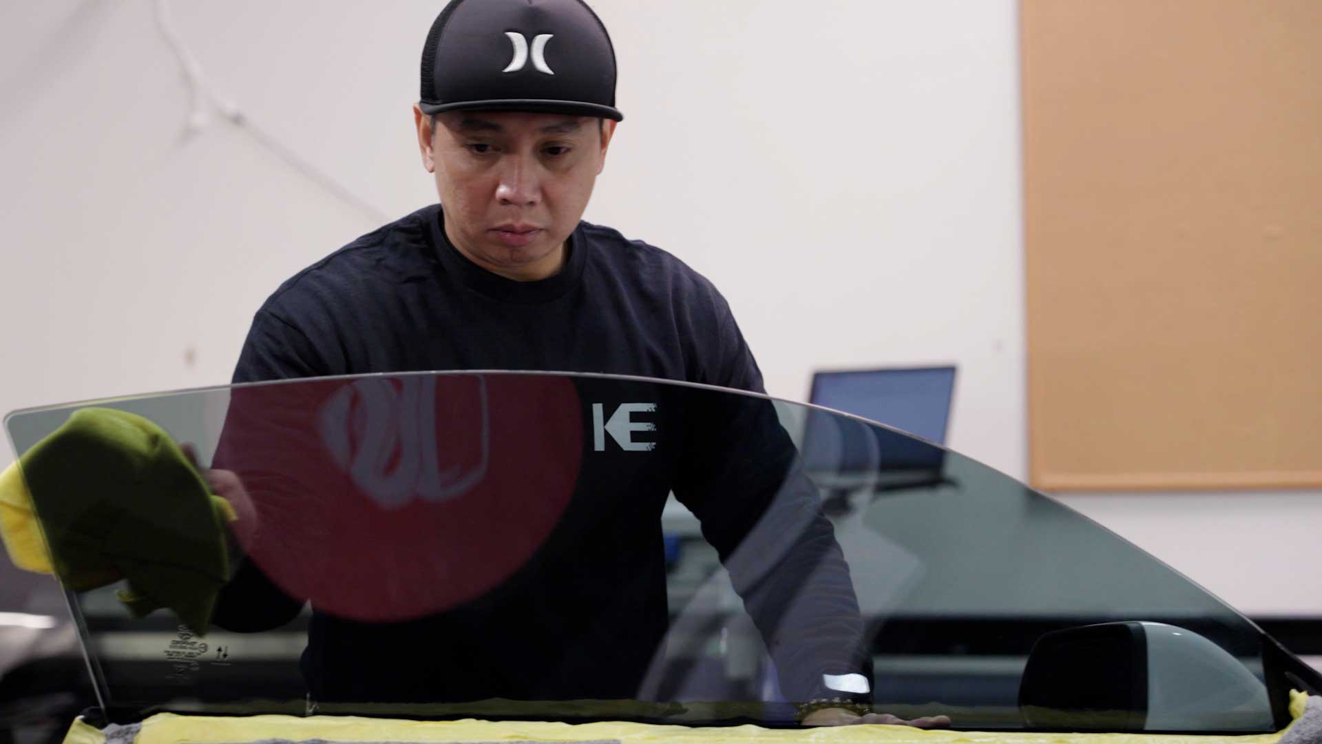 Professional Electric Vehicle Glass Tinting being cleaned after tinting in Lawton