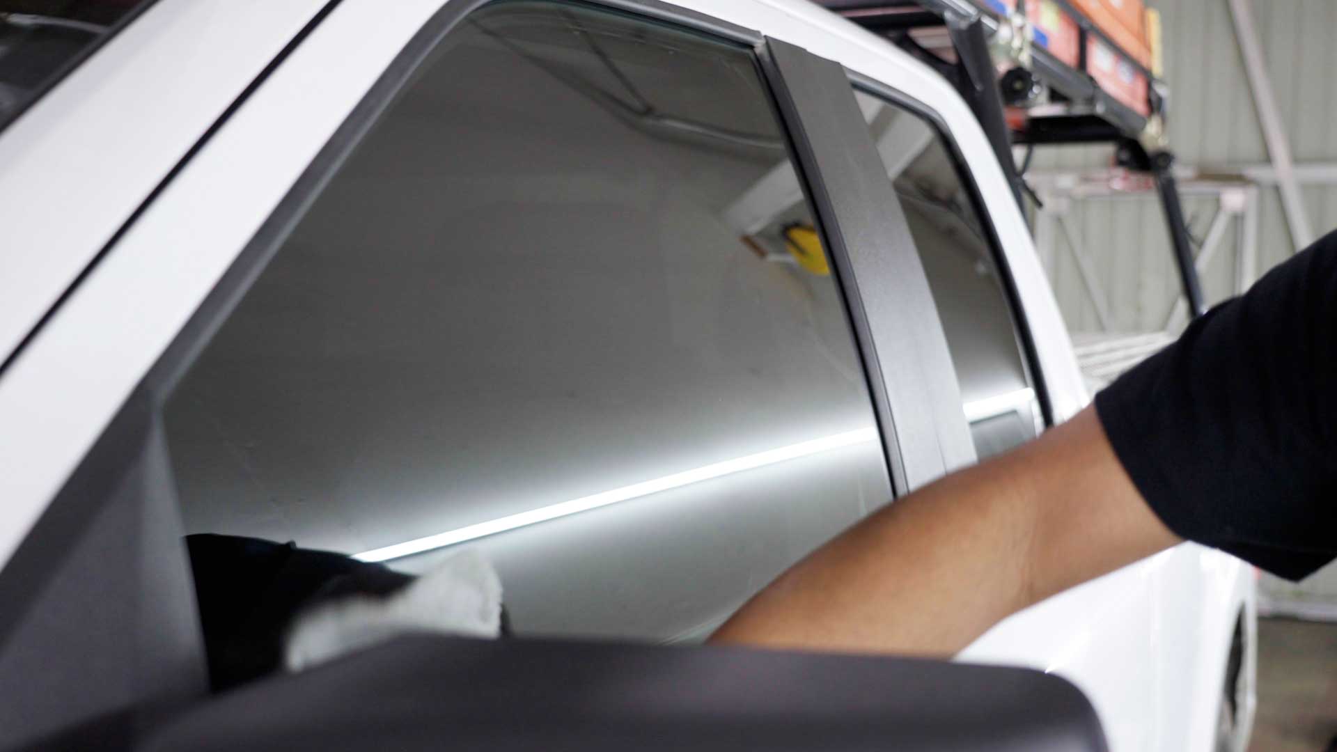 Professional Tesla Glass Tinting being cleaned after tinting in Silver Spring