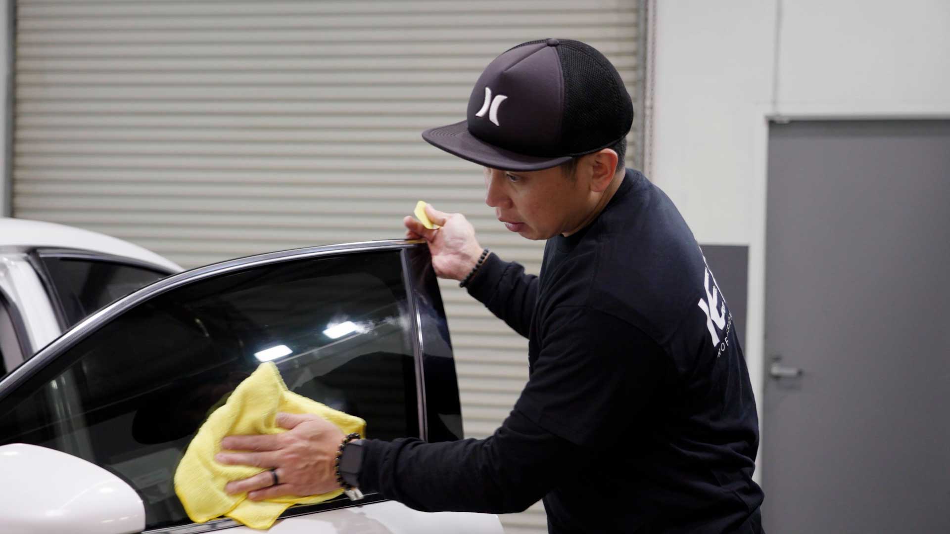 Skilled Tesla Window Tinting being cleaned after tinting in Murdock