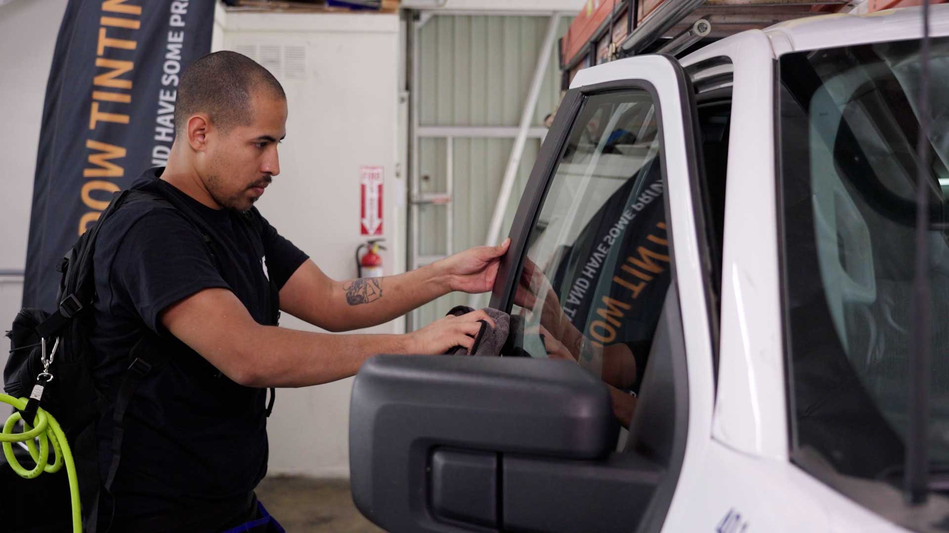 Expert Electric Vehicle Glass Tinting being cleaned after tinting in Albany