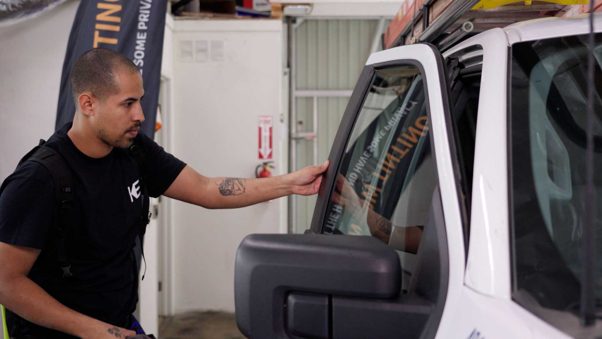 Skilled Tesla Window Tinting being cleaned after tinting in Kyle