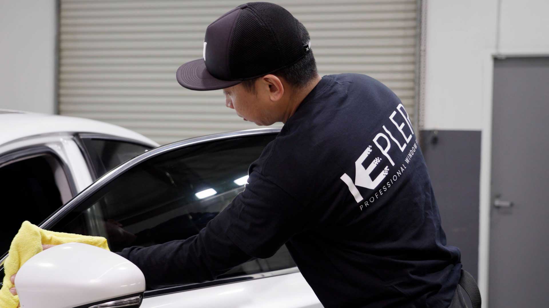 Professional Tesla Glass Tinting being cleaned after tinting in Springboro