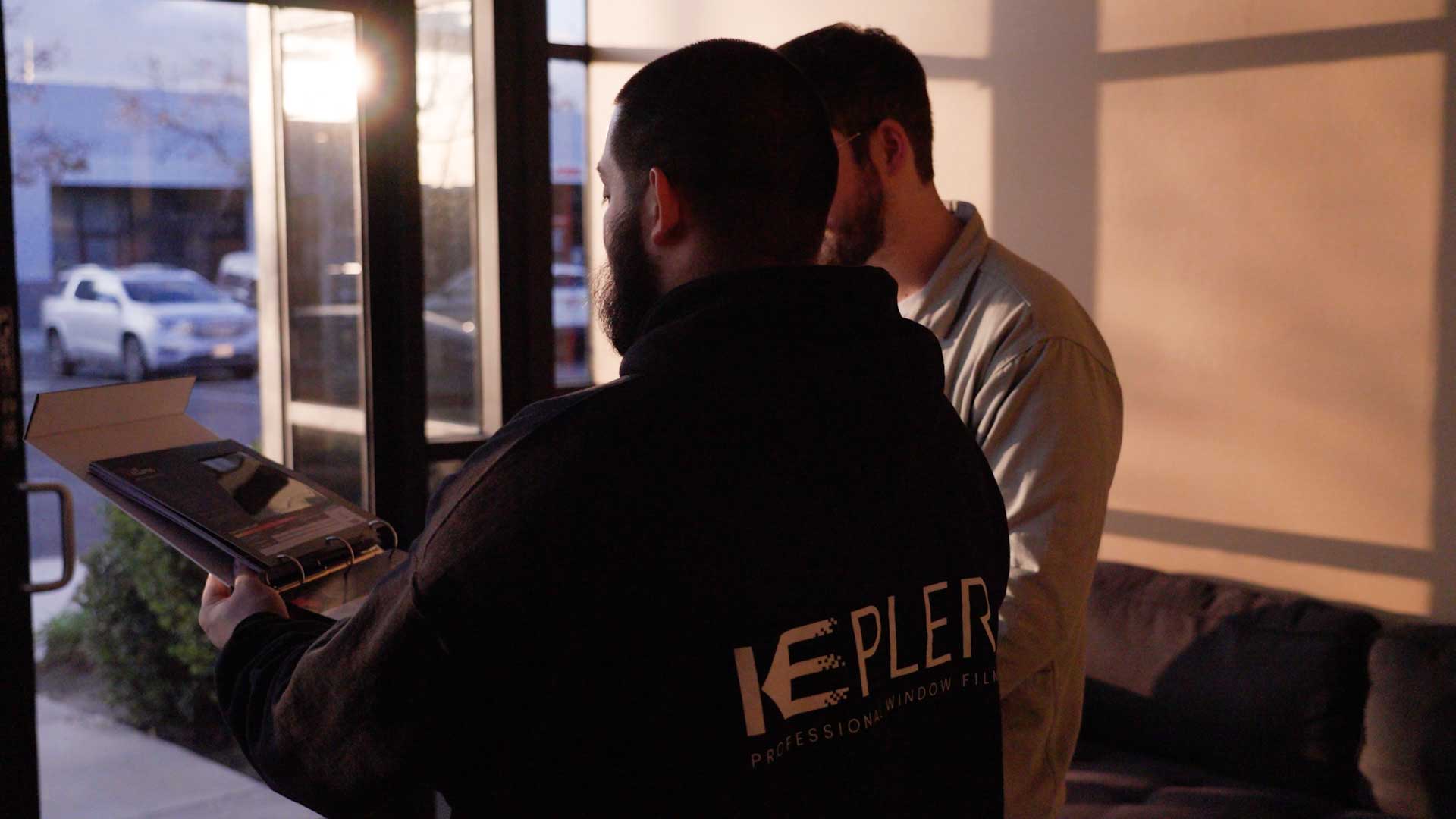 Kepler Specialist Discussing Commercial Window Tinting Prices with Customer in Alaska