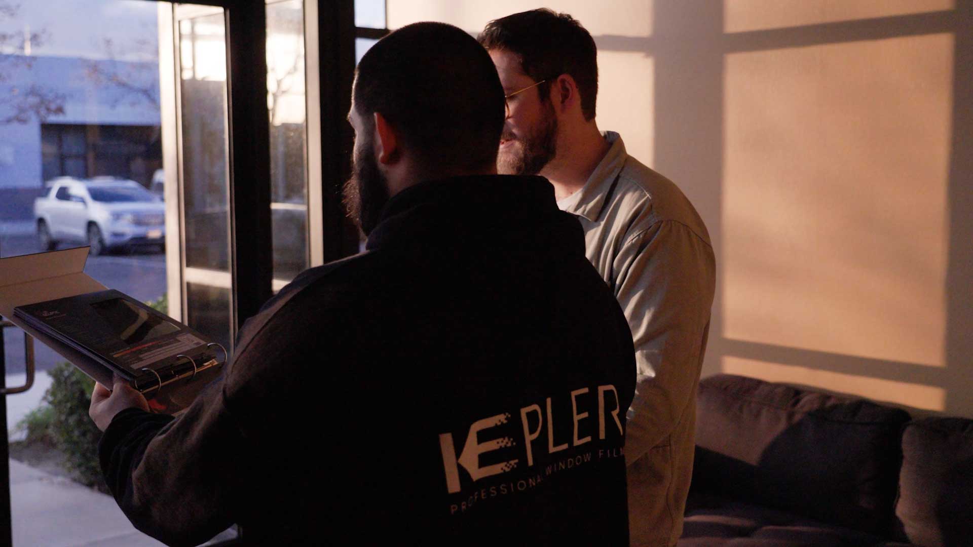 Kepler Dealer Showing Customer the Benefits of Commercial Window Film